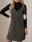 White FJØRNA sleeveless midi dress with suspenders and V-neck, displayed hanging on a mannequin.