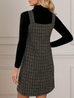 White FJØRNA sleeveless midi dress with suspenders and V-neck, featuring a stylish and elegant design.