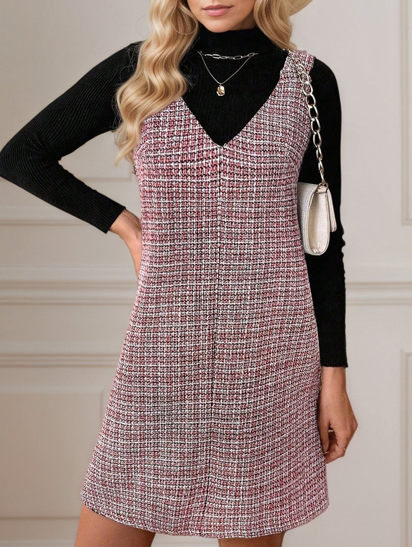 White sleeveless midi dress with suspenders and V-neck from FJØRNA, featuring a sleek, modern design.