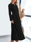 FJØRNA black V-neck pleated waist tiered long-sleeved dress, featuring a flowing design and feminine silhouette.