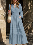FJØRNA white V-neck pleated waist tiered long-sleeved dress, stylish and elegant, with flowing fabric and a fitted waist.