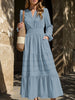 FJØRNA white V-neck pleated waist tiered long-sleeved dress, stylish and elegant, with flowing fabric and a fitted waist.