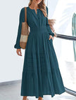 FJØRNA white V-neck pleated waist tiered long-sleeved dress, elegant and flowing with a fitted bodice and layered skirt.