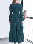 White V-neck pleated waist tiered long-sleeved dress by FJØRNA, featuring a flowing silhouette and elegant design.