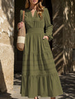 FJØRNA white V-neck pleated waist tiered long-sleeved dress, elegant and flowing with a stylish design.