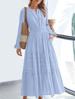 Light blue V-neck pleated waist tiered long-sleeved dress by FJØRNA, featuring a flowing design and elegant silhouette.