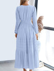 Light blue V-neck pleated waist tiered long-sleeved dress by FJØRNA, showcasing a flowing, elegant design with tiered layers.