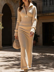 FJØRNA zipper slim fit long white dress, elegant design, close-up of the dress showcasing its fitted silhouette and front zipper detail.