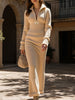 FJØRNA zipper slim fit long white dress, elegant design, close-up of the dress showcasing its fitted silhouette and front zipper detail.
