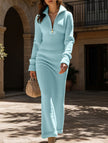 FJØRNA zipper slim fit long white dress, elegant design with a fitted silhouette, displayed on a hanger against a plain background.