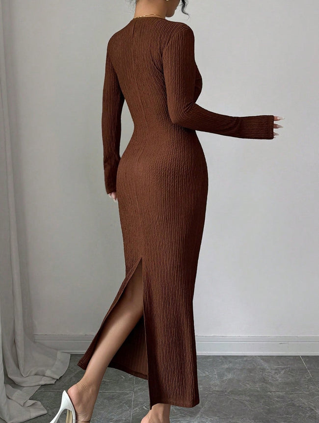 White cross neck knit slim-fit dress by FJØRNA displayed on a model, showcasing its elegant design and fitted silhouette.