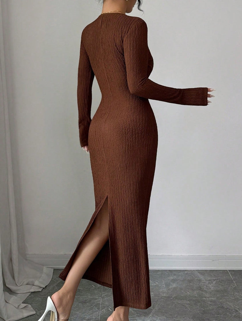 White cross neck knit slim-fit dress by FJØRNA displayed on a model, showcasing its elegant design and fitted silhouette.