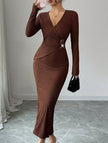 White cross-neck knit slim-fit dress by FJØRNA, featuring a stylish design and fitted silhouette on a model.
