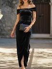 Black strapless FJØRNA bodycon maxi dress displayed on a hanger with a fitted silhouette and elegant design.