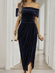 FJØRNA strapless white bodycon maxi dress displayed on a hanger, showcasing its sleek, fitted silhouette and elegant design.