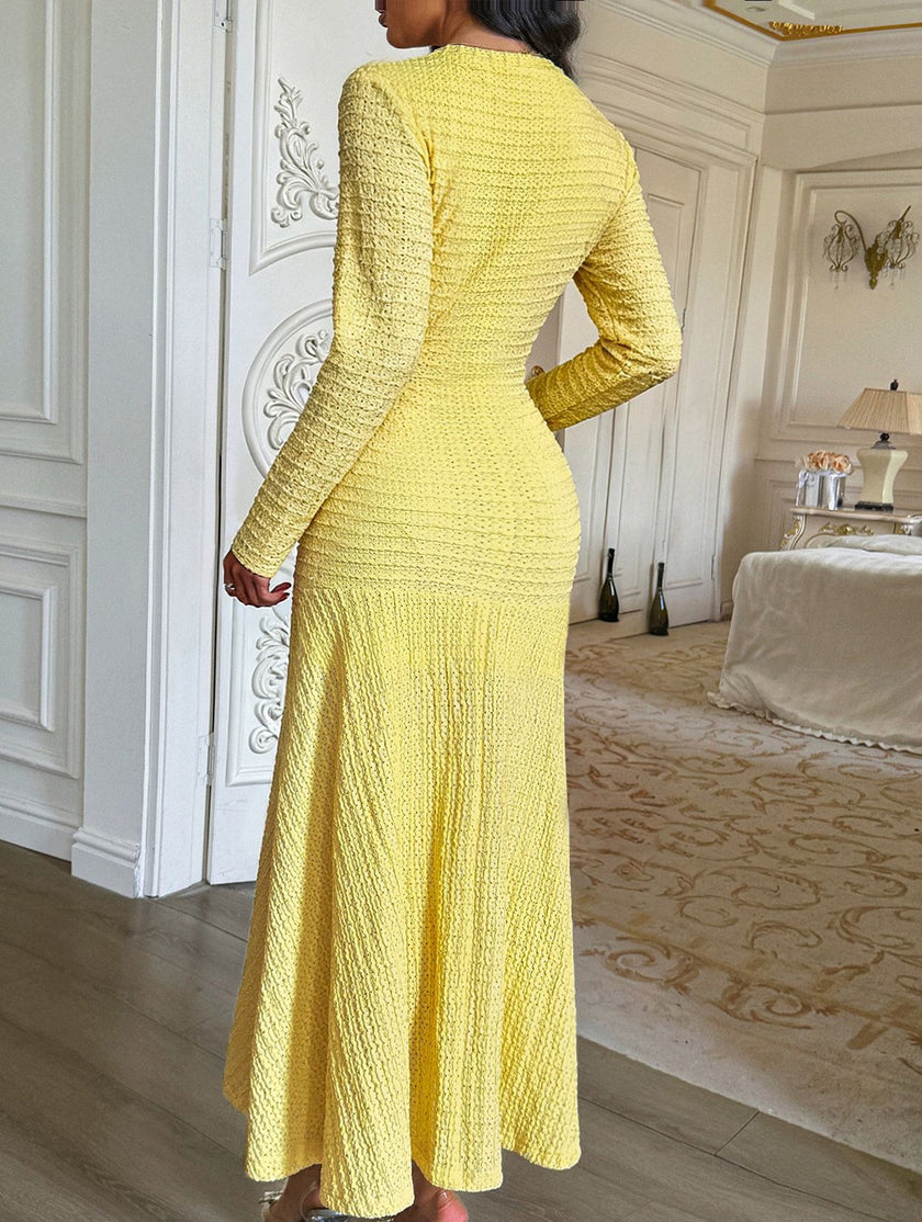 FJØRNA retro solid yellow bodycon dress, form-fitting design, sleeveless with a round neckline, displayed on a hanger.