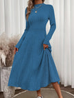 Blue FJØRNA brushed ribbed long dress with round neckline, featuring a comfortable, fitted silhouette and soft textured fabric.