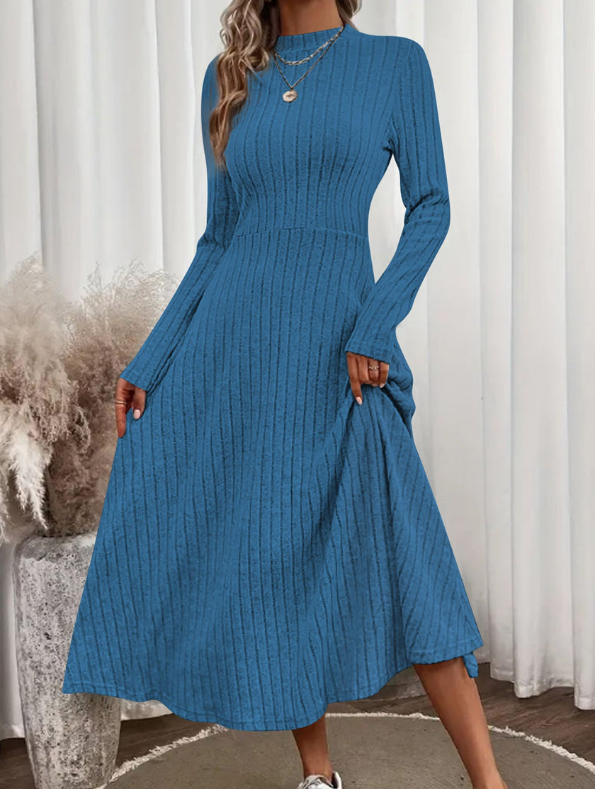 Blue FJØRNA brushed ribbed long dress with round neckline, featuring a comfortable, fitted silhouette and soft textured fabric.