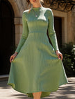 White FJØRNA round neck brushed ribbed long dress displayed on a hanger, showcasing its soft fabric and relaxed fit.