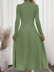 White FJØRNA round neck brushed ribbed long dress displayed on a model, showcasing its relaxed fit and textured fabric.