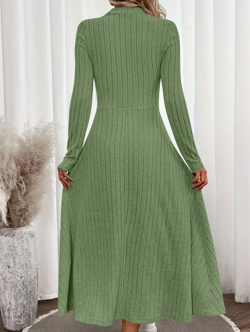 White FJØRNA round neck brushed ribbed long dress displayed on a model, showcasing its relaxed fit and textured fabric.