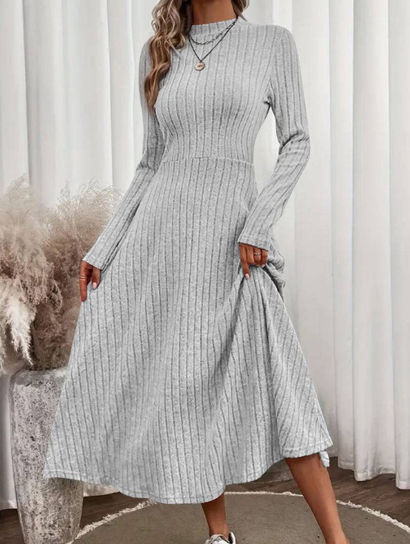 FJØRNA white brushed ribbed long dress with round neck, cozy and stylish, shown on a model.