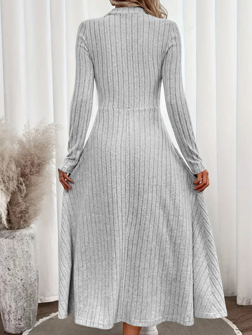 FJØRNA white round neck brushed ribbed long dress laid flat, showcasing its soft texture and simple elegant design.