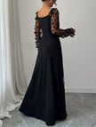 Black retro-style hollowed-out long-sleeved dress by FJØRNA featuring a unique cut-out design and fitted silhouette.