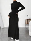 Black ribbed brushed long-sleeved dress by FJØRNA, featuring a solid color and fitted design, worn on a model.
