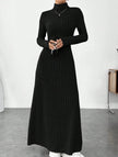 Black ribbed brushed long-sleeved dress by FJØRNA, featuring a solid color and fitted silhouette.