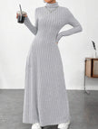 Light grey ribbed long-sleeved dress by FJØRNA, solid color, brushed fabric, form-fitting design, shown on a model.