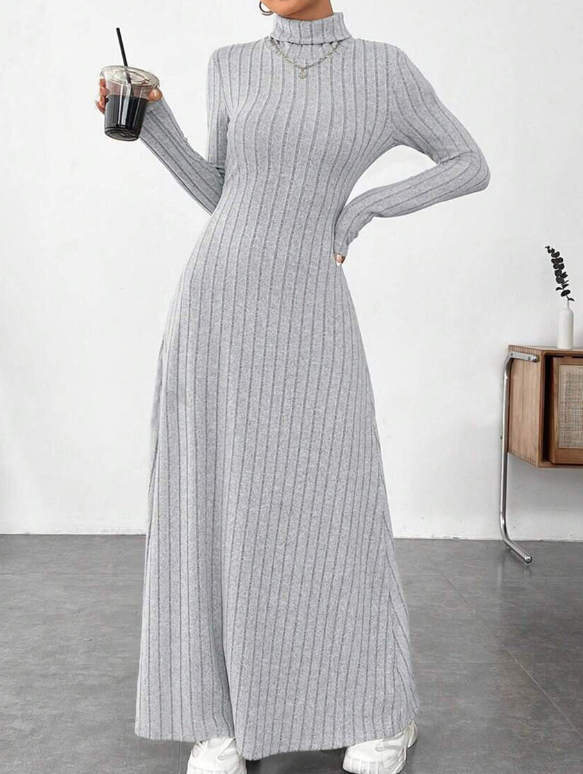 Light grey ribbed long-sleeved dress by FJØRNA, solid color, brushed fabric, form-fitting design, shown on a model.