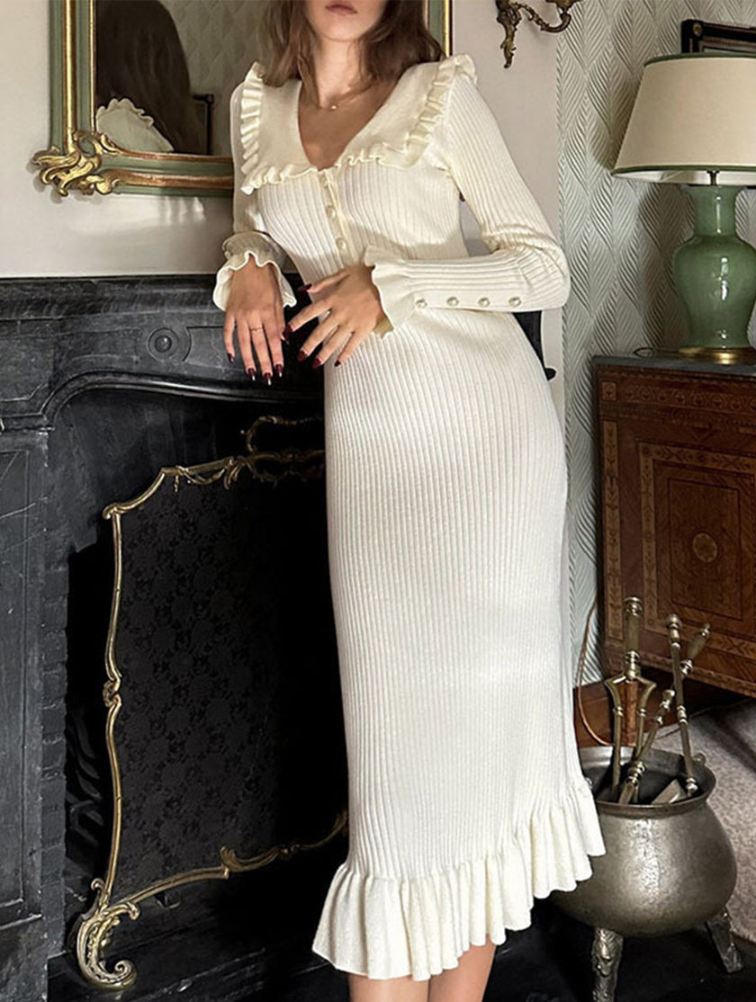 White retro ruffled knit dress by FJØRNA, featuring a vintage-inspired design with ruffles and a fitted silhouette.