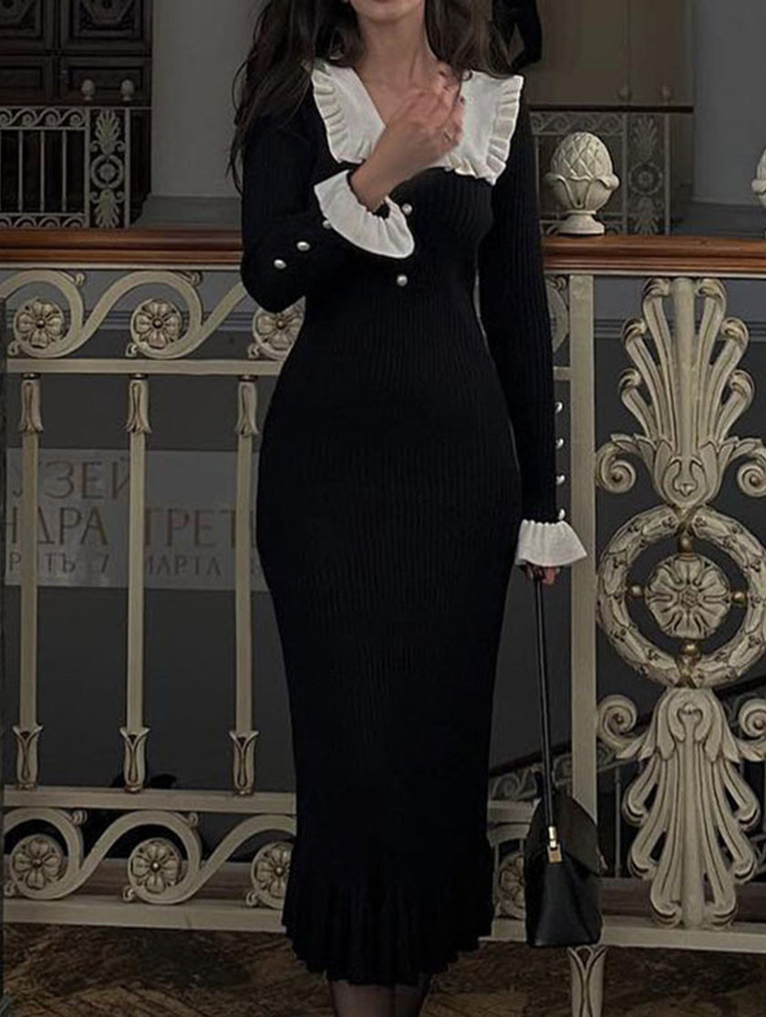 Black retro ruffled knit dress by FJØRNA featuring a fitted silhouette and ruffle details, perfect for stylish occasions.
