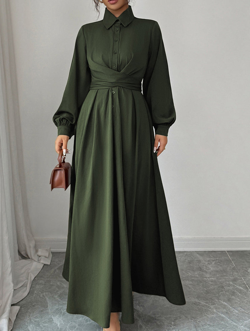 White long-sleeved dress by FJØRNA, simple and elegant with a fitted silhouette, shown on a model.