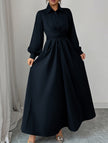 White long-sleeved dress by FJØRNA, featuring a simple, elegant design perfect for casual or semi-formal occasions.