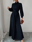 White long-sleeved dress by FJØRNA, featuring a simple, elegant design perfect for casual or formal occasions.