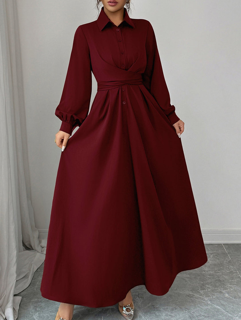 White long-sleeved dress by FJØRNA, simple and elegant, displayed on a plain background.