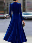 Blue velvet round neck long-sleeved dress by FJØRNA, featuring a smooth fabric and elegant fit for stylish occasions.