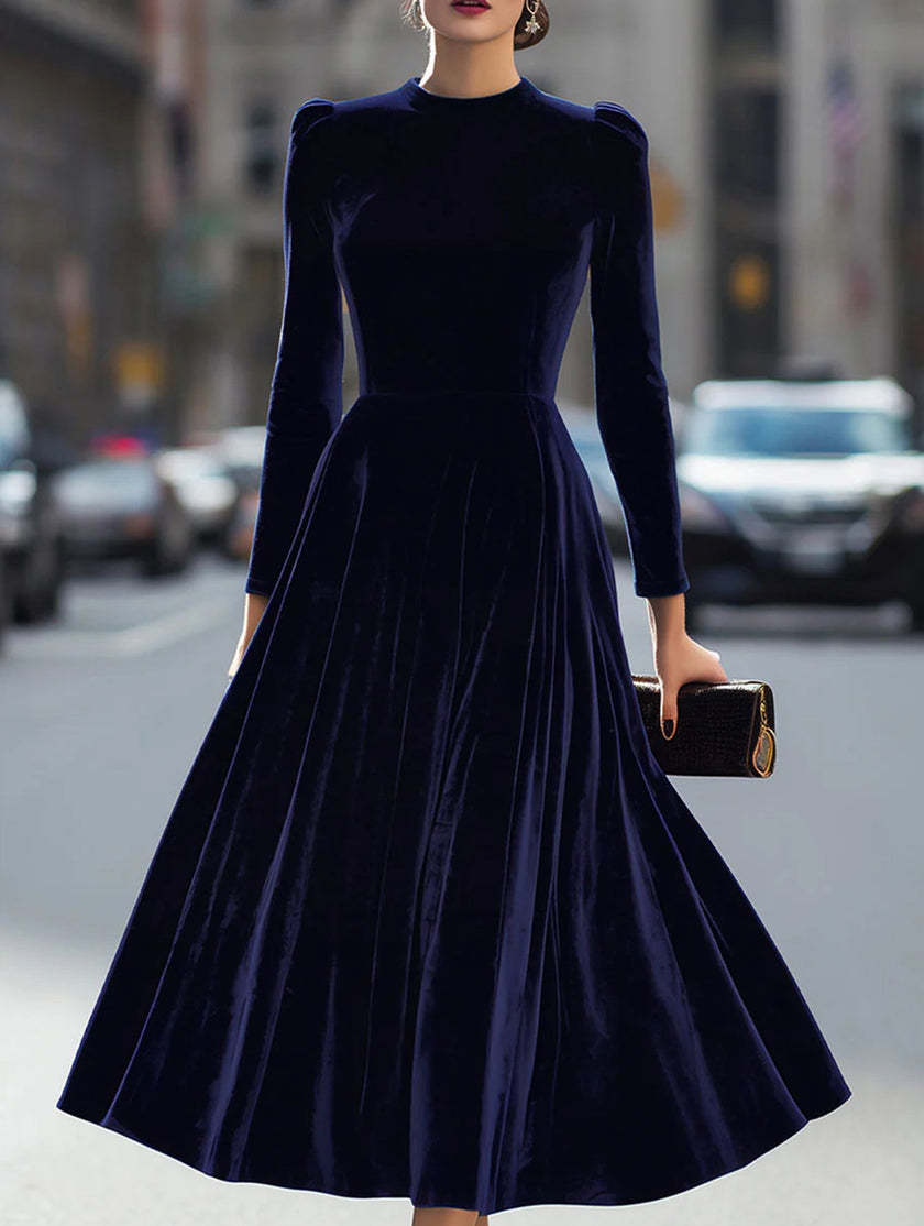 FJØRNA velvet long-sleeved round neck dress in navy, showcasing a smooth fabric and elegant fit.