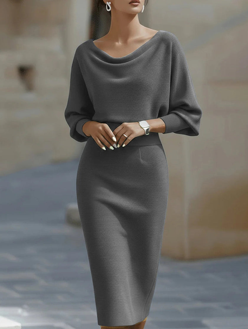 FJØRNA elegant slim fit knit dress in white, showcasing a stylish, form-fitting design with long sleeves and a round neckline.