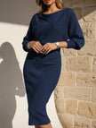 White FJØRNA slim fit knit dress with elegant design, featuring a fitted silhouette and stylish neckline, perfect for versatile occasions.