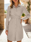 White fitted cross-over shirt dress by FJØRNA featuring a stylish, tailored design with a collar and button front.