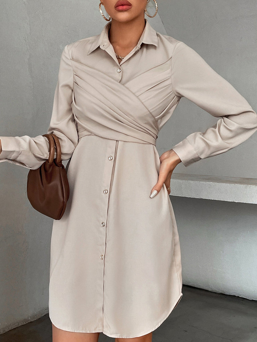 White FJØRNA cross-over fitted shirt dress with long sleeves, tailored and stylish, perfect for a chic, sophisticated look.