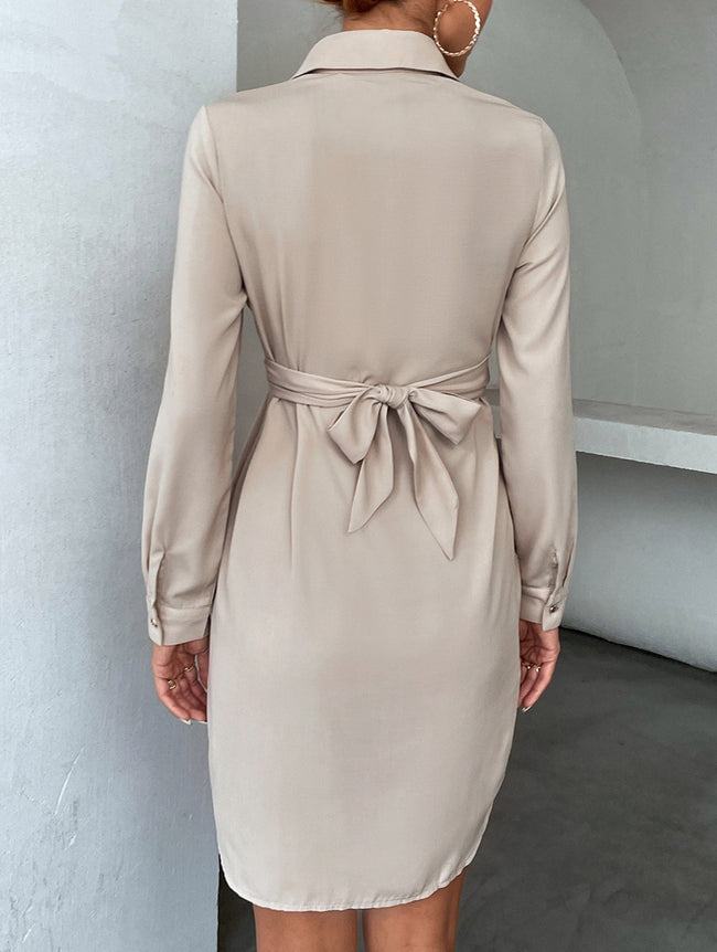 White FJØRNA cross-over fitted shirt dress, stylish and elegant with a tailored silhouette, shown on a model.