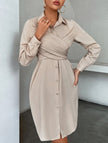 White cross-over fitted shirt dress by FJØRNA, featuring a sleek, tailored design with a collared neckline and button front.