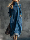 FJØRNA navy blue turtleneck dress with relaxed fit, long sleeves, and knee-length silhouette, displayed on a mannequin.