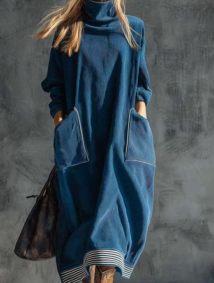 FJØRNA navy blue turtleneck dress featuring a relaxed fit and long sleeves, styled for casual or elegant occasions.