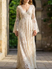 White lace bell-sleeve long dress by FJØRNA featuring resort style and elegant design, shown on a model against a neutral background.