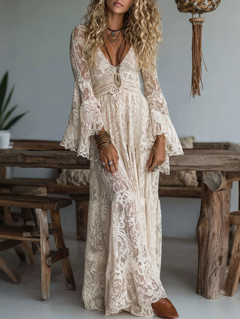 White lace bell-sleeve long dress by FJØRNA featuring resort-style design and elegant flowing silhouette.